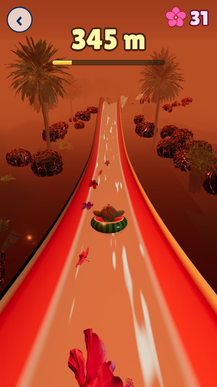 A red slide winds through Volcano Gorge, with glowing rocks either side.