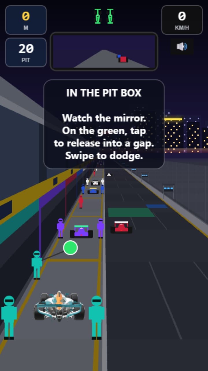Waiting in the pit box: the mirror at the top, the crew either side, and a green light to go.
